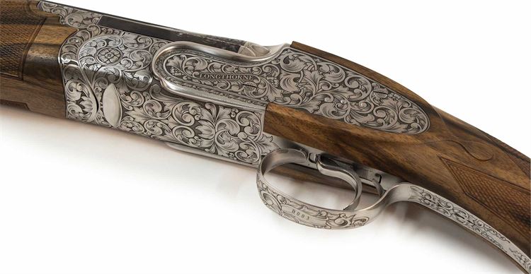 Intricate engraving on the shotgun